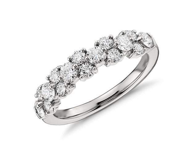 Delicate in design, elegant in form, this masterfully crafted diamond ring features  brilliant round diamonds fashioned into a contemporary  garland design.  To prevent damage to the exposed diamonds, we recommend wearing this ring alone.