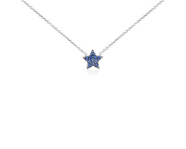 Let your style shine bright with this dainty star pendant, delicately accented with vibrant sapphire gemstones, suspended  from a 14k white gold cable chain necklace.