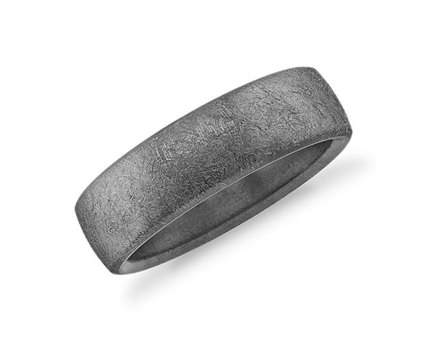 This wedding band's tantalum construction provides durability and a comfortable fit. It's swirled texture give a rugged, masculine feel to the low-domed design.