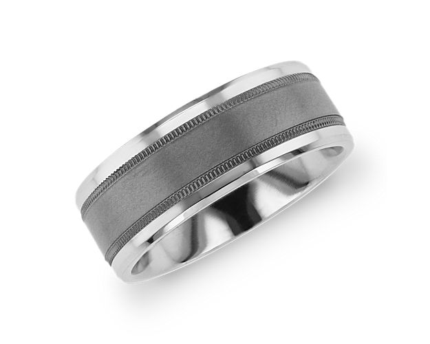 Beveled edges and milgrain inlay give this tantalum and 14k white gold wedding band enduring strength and subtle, textural touches.