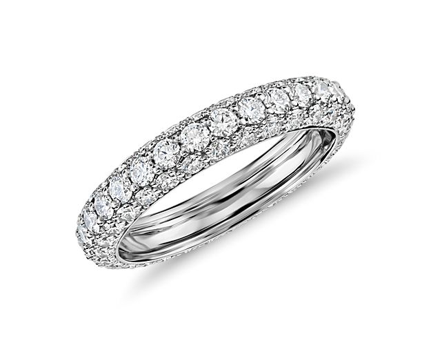 This striking triple row, pavé set diamond eternity ring set in platinum is guaranteed to catch the light and sparkle forever.