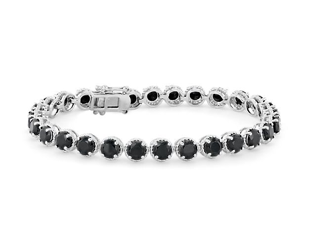 Richly hued, this onyx bracelet is crafted in sterling silver and features twenty-eight round onyx gemstones in a flexible single line design.