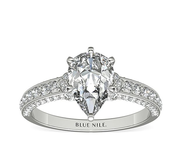 With a touch of elegance, this diamond engagement ring features pavé-set diamond rolling across the shank of the ring, all set in enduring platinum.