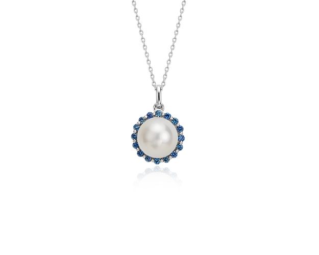 This halo pendant is irresistible and chic, featuring a beautiful freshwater cultured pearl surrounded by a bevy of sapphires.