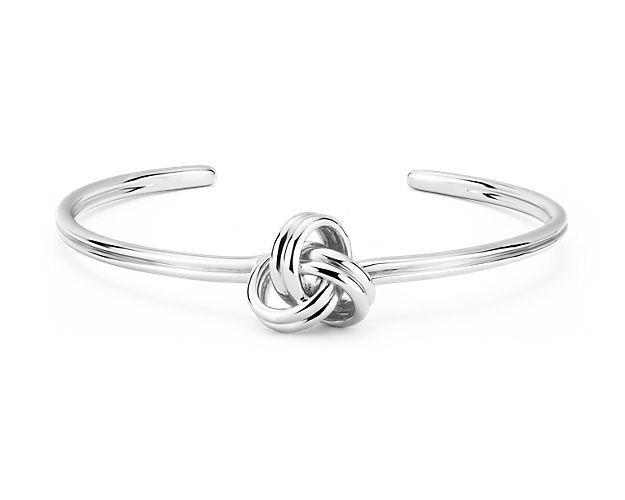 Choose this open and airy grande luxe love knot cuff for a modern take on a classic. Crafted in solid sterling silver, this casual cuff bracelet lends a sophisticated charm to your everyday look.