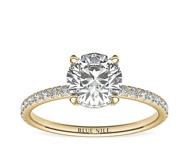 Beautifully crafted, this Blue Nile Studio 18k yellow gold engagement ring features french pavé-set diamonds encompassing the center diamond of your choice.