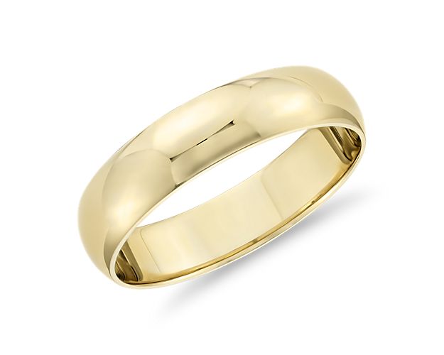 This classic 14k yellow gold wedding ring will be a lifelong essential. The light overall weight of this style, its classic 5mm width, and low profile aesthetic make it perfect for everyday wear. The high polished finish and goes-with-anything styling are a timeless design.