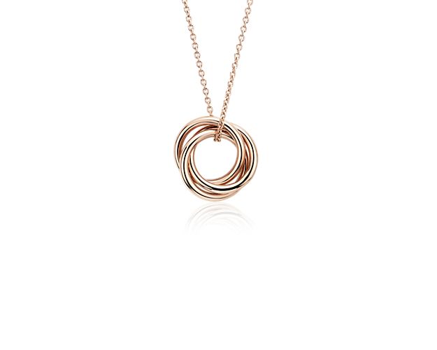A delicate statement, this petite infinity rings pendant features three intertwined rings crafted of lightweight, polished tubing in 14k rose gold for a look that's made to go wherever you go.