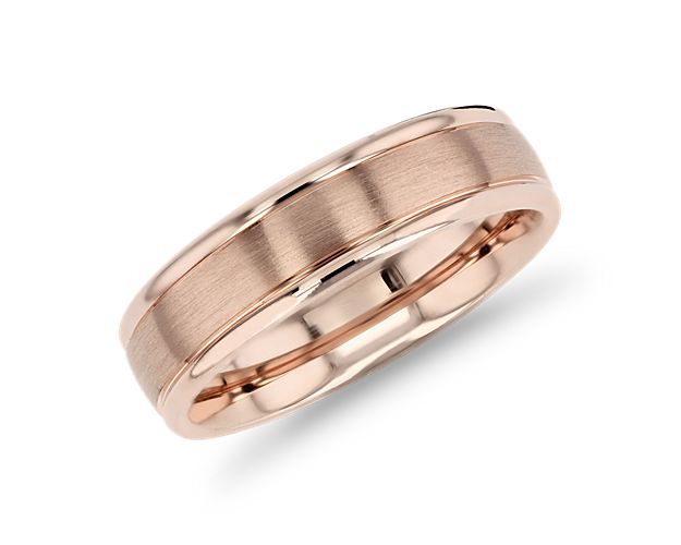 A brushed inlay creates a striking contrast on this 14k rose gold band.