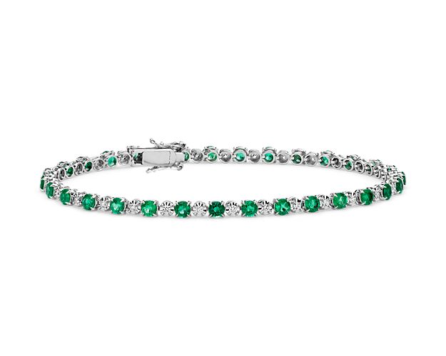 Crafted from 14k white gold, and secured by a subtle box catch, this remarkable bracelet showcases prong-set emeralds and diamonds arranged in alternating order to highlight the gemstones’ verdant greens and dazzling sparkle. 