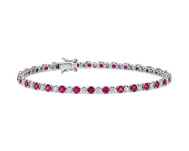 Richly-hued rubies give this classic tennis bracelet a colorful update. Set in 14k white gold, and secured with a subtle box catch, this piece is the perfect mixture of vibrant color and brilliance 