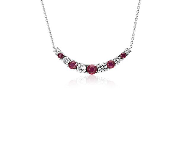 Flash a truly dazzling smile with this beaming 14k white gold necklace's graduated array of round rubies and brilliant-cut diamonds. For added versatility, this necklace can be adjusted in length between 16 and 18 inches.