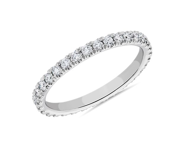 An expression of luxurious elegance, this band crafted in platinum is pavé set with brilliant diamonds that encircle the ring. A perfect match with any solitaire or stock number 71086.