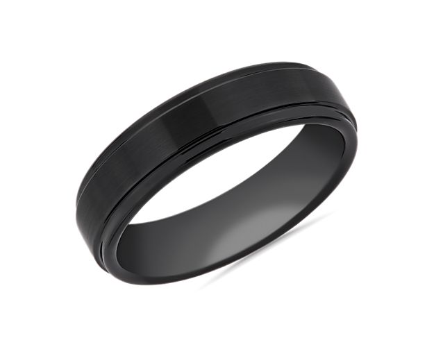 Substantial in feel, this wedding ring is crafted from black tungsten carbide and features lowered edges highlighting the satin finish.
