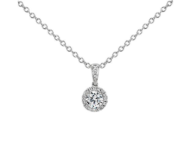 Elegant and graceful, this diamond pendant showcases a circle of sparkling micropavé diamonds to frame your center round diamond, set in platinum with a matching adjustable cable chain 16-18inches in length.