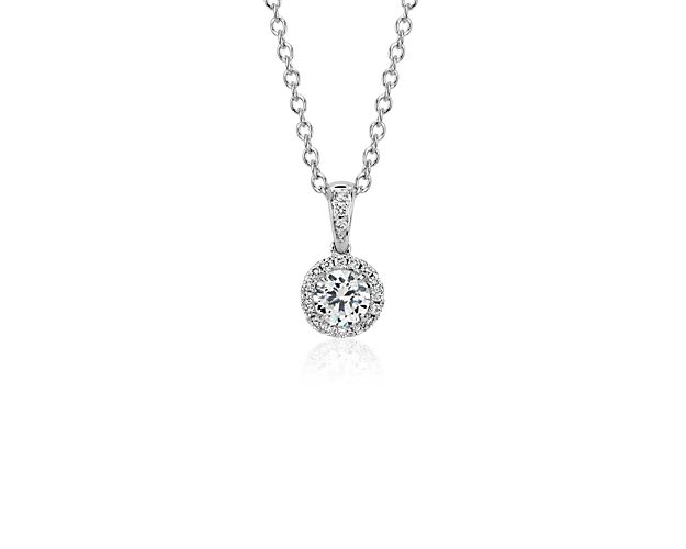 Elegant and graceful, this diamond pendant showcases a circle of sparkling micropavé diamonds to frame your center round diamond, set in 14k white gold adjustable cable chain 16-18inches in length.