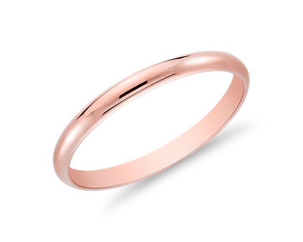 A perfect complement to any engagement ring, this wedding band in 14k rose gold strikes the slimmest outline at only 2mm wide.