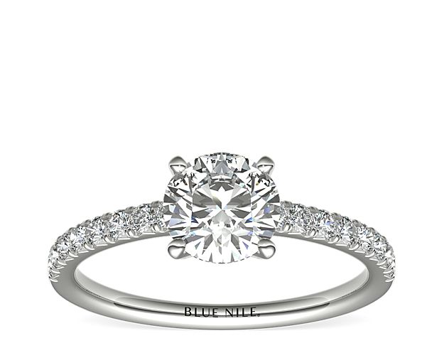 Eyes will be fixated on this immaculate 14k White Gold diamond engagement ring, showcasing French pavé-set diamonds that complement your choice of center diamond.
