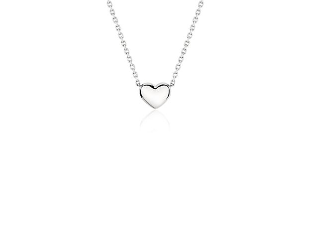 Timeless and classic, this mini heart necklace is the perfect everyday piece. Perfect for wearing alone or layering it with other pieces, this petite pendant is suspended from a matching cable chain that can fasten at 16 or 18 inches.