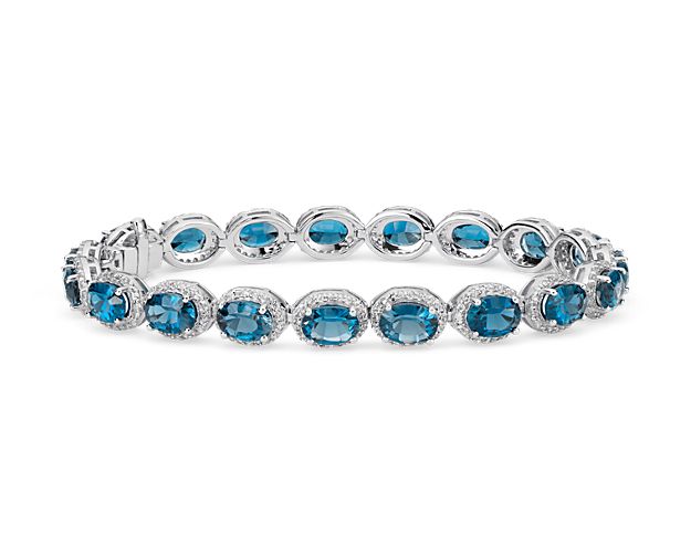 A great complement to any style, this gemstone bracelet showcases vibrant London blue topaz accented with a sparkling halo of pavé-set white topaz framed in sterling silver.