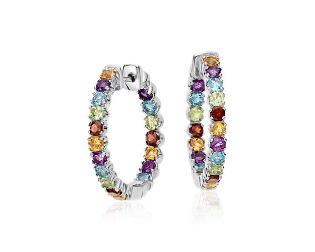 Add a touch of color to your look with these muti-gemstone hoop earrings. Amethyst, peridot, garnet, blue topaz and citrine sparkle along a sterling silver frame.