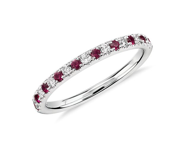 Dainty and brilliant, this stackable Riviera ring features alternating pavé set diamonds and rubies crafted of 14k white gold in a petite design.