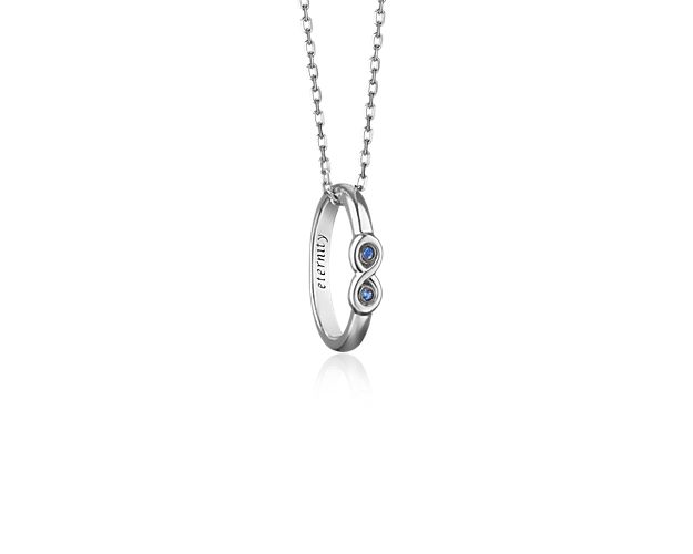Made from sterling silver this poesy ring necklace features a classic infinity motif with sapphire accents and is a timeless expression of love with "Eternity" inscribed on the inside of the ring. The Poesy Ring Collection is inspired by a 500 year old tradition where knights gave their maidens rings with inscriptions of poesies.