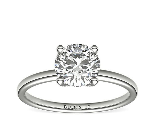 Beautifully crafted, this Blue Nile Studio platinum engagement ring features a french pavé-set diamond basket adorning the round diamond of your choice.
