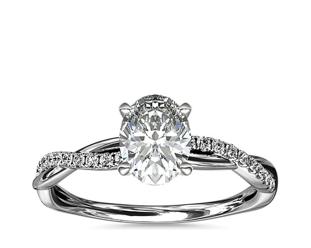 Classic with a twist, this 14k white gold engagement ring features a delicate twist of pavé-set diamonds that will complement the center diamond of your choice.