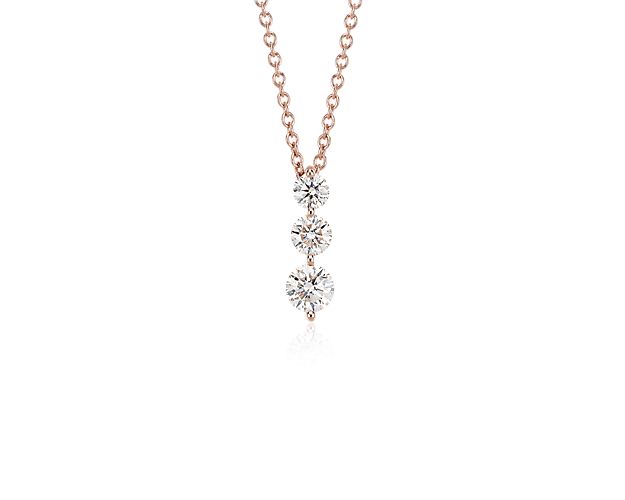 This three-stone diamond drop pendant symbolizes your past, present, and future with brilliance. Crafted in polished 18k rose gold, three graduated-size diamonds cascade in shared prongs that allow for maximum sparkle. The pendant hangs from a matching classic cable chain with a secure lobster claw clasp.