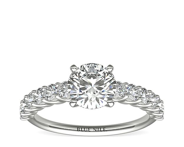 Exquisite in design, the Luna diamond engagement ring features a row of twelve brilliant diamonds in a shared-prong setting to beautifully frame your center diamond. Diamonds equal 1/2 carat total weight.