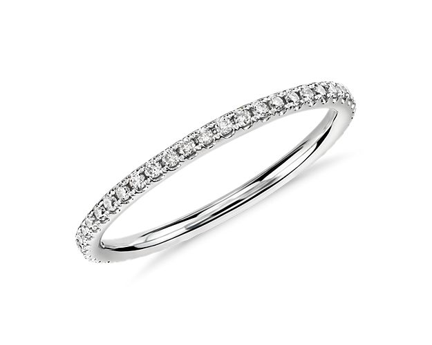 Delicate and beautiful, this petite  micropavé diamond eternity ring showcases sparkling round micropavé diamonds set in 14k white gold.