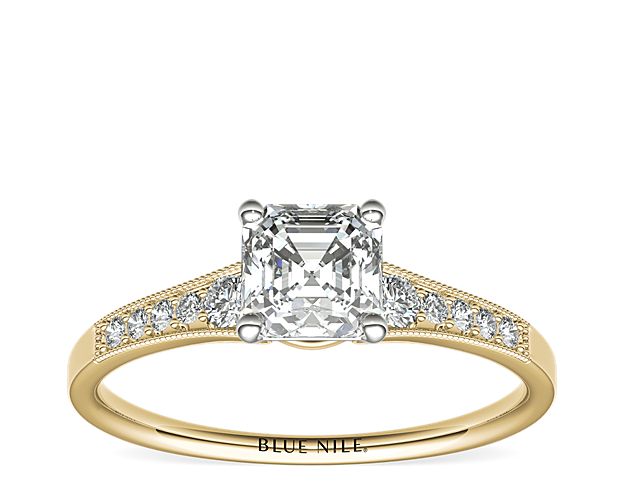 Ideal for any center diamond of your choice, this 14k yellow gold engagement ring showcases a diamond accent along the shank and milgrain detailing.