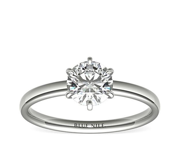 Beautifully classic, this solitaire engagement ring is crafted in 14k white gold with a six-prong design to highlight your center diamond.