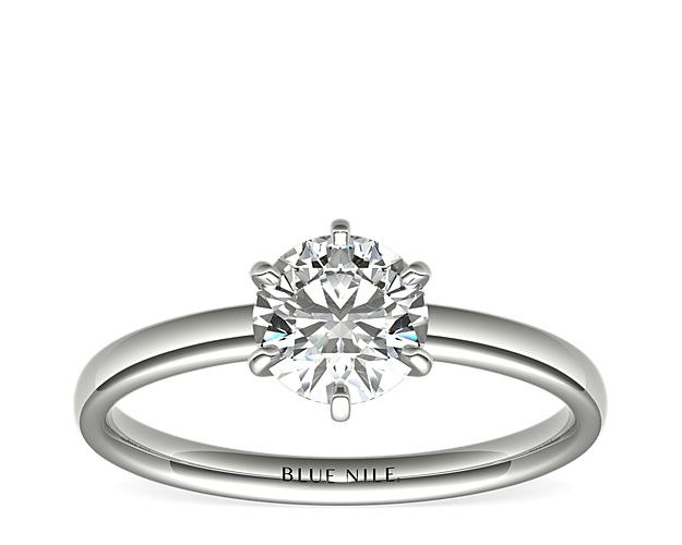 Beautifully classic, this solitaire engagement ring is crafted in platinum with a six-prong design to highlight your center diamond.