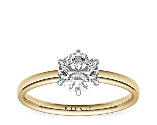 This enduring engagement ring setting features six-prongs to showcase your diamond and is crafted in 18k yellow gold with a low dome design for a comfortable fit.