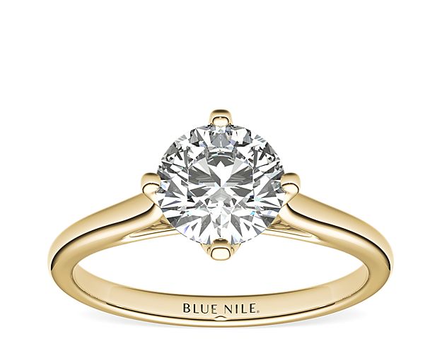 Show your love with this 14k yellow gold engagement ring, featuring a east west prong set solitaire diamond.