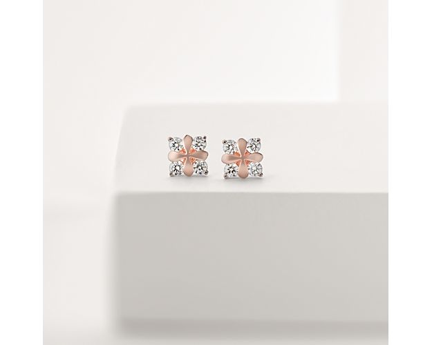 Stunning all over, these one-of-a-kind petal-inspired earrings showcase round brilliant diamonds framed in 18k rose gold.