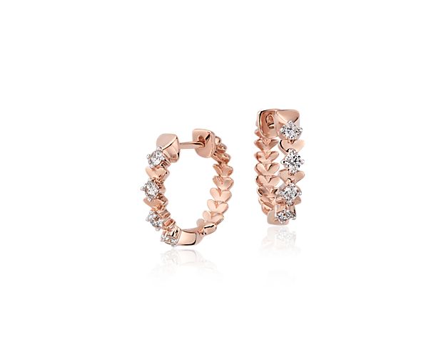 Stunning all over, this one-of-a-kind petal-inspired hoop earring showcases round brilliant diamonds framed in 18k rose gold.