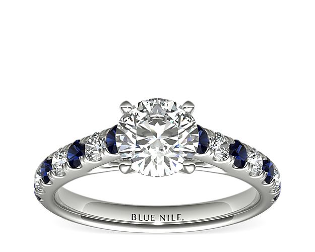 This striking platinum setting features alternating pavé-set sapphires and round diamonds; the perfect complement to your choice of center diamond.