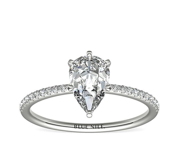 Delicate and beautiful, this diamond engagement ring in platinum features a half circle of sparkling petite micropavé diamonds to complement your center diamond.