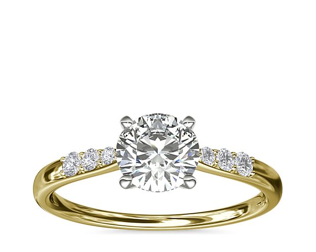 Complement your center diamond perfectly with this 14k yellow gold engagement ring accented with pavé-set diamonds along the shank.