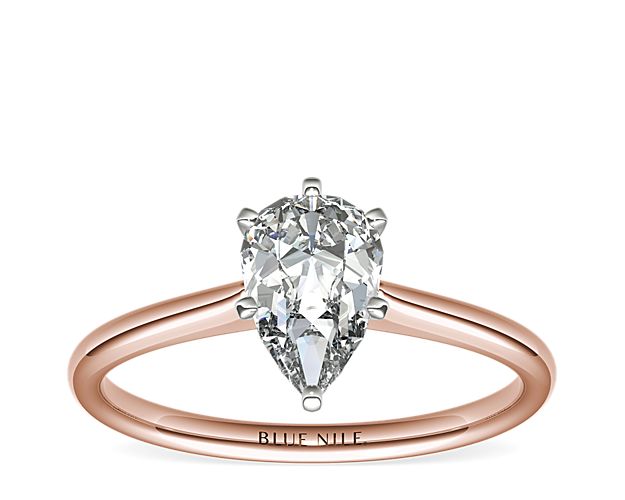 Elegant in its simplicity, this petite solitaire crafted in 14k rose gold is a beautifully classic frame for your choice of center diamond.