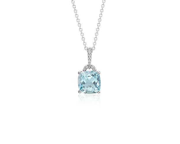 A sparkling complement, this gemstone and diamond pendant features a light blue cushion cut aquamarine and a brilliant round diamond bail set in 14k white gold with a matching cable chain necklace.