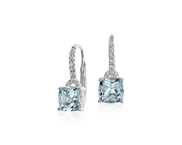 Fluid and elegant, these drop earrings feature beautiful cushion cut aquamarine gemstones framed with round brilliant diamonds in 14k white gold.