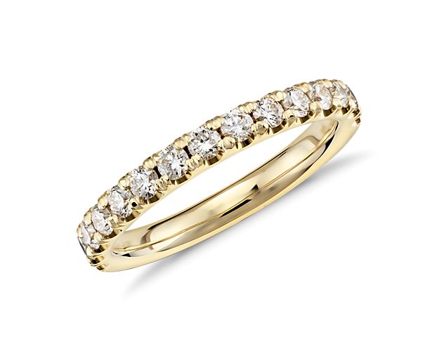Accentuate the moment with this beautiful 1/2 carat pavé-set diamond ring in illuminating 18k yellow gold.