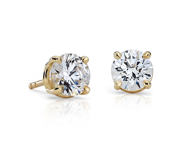 These Classic Four-Prong Earrings in 18k Gold are set with your choice of perfectly matched diamonds.