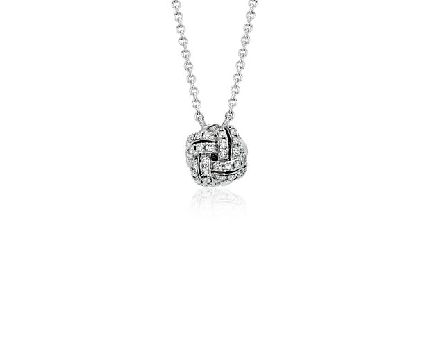 Simply elegant, this diamond love knot necklace features round pavé-set diamonds intricately set in polished 14k white gold.