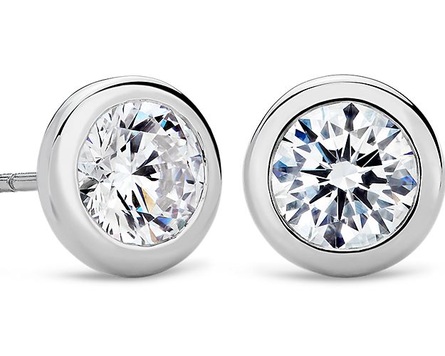 Enduring in every way, these platinum bezel earring settings will complement your choice of round diamonds.