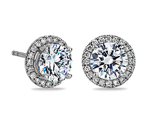 These elegant platinum earring settings will maximize the brilliance of your choice of round diamonds. Each earring is pavé-set with round diamonds.